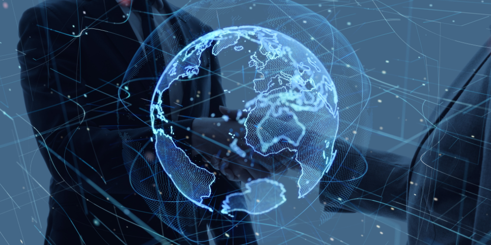 Two businessmen shaking hands with a holographic globe – symbolizing global partnerships with Sinford Clearing & Forwarding