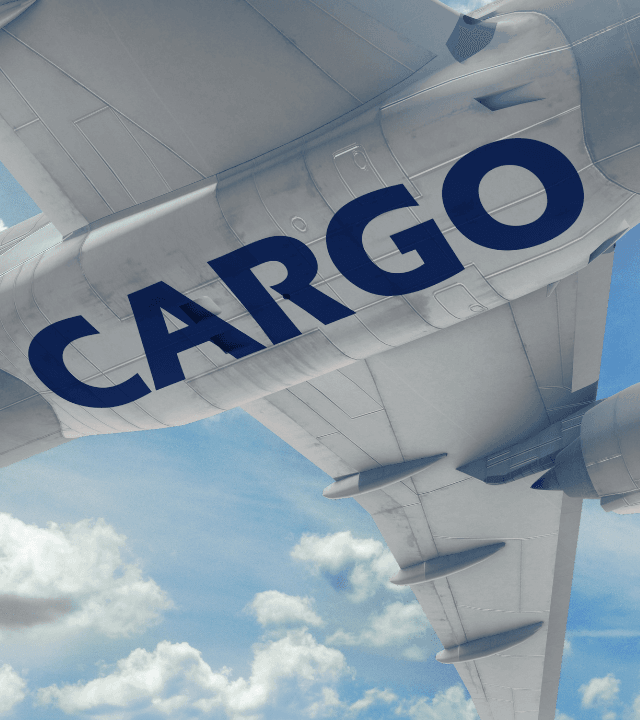 Cargo aircraft flying overhead representing integrated air freight and logistics solutions
