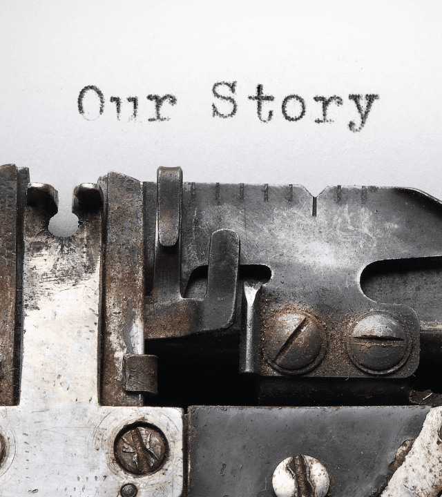 Close-up of an old typewriter with the words “Our Story” and the phrase “Built at a Braai. Built for Global Logistics.”